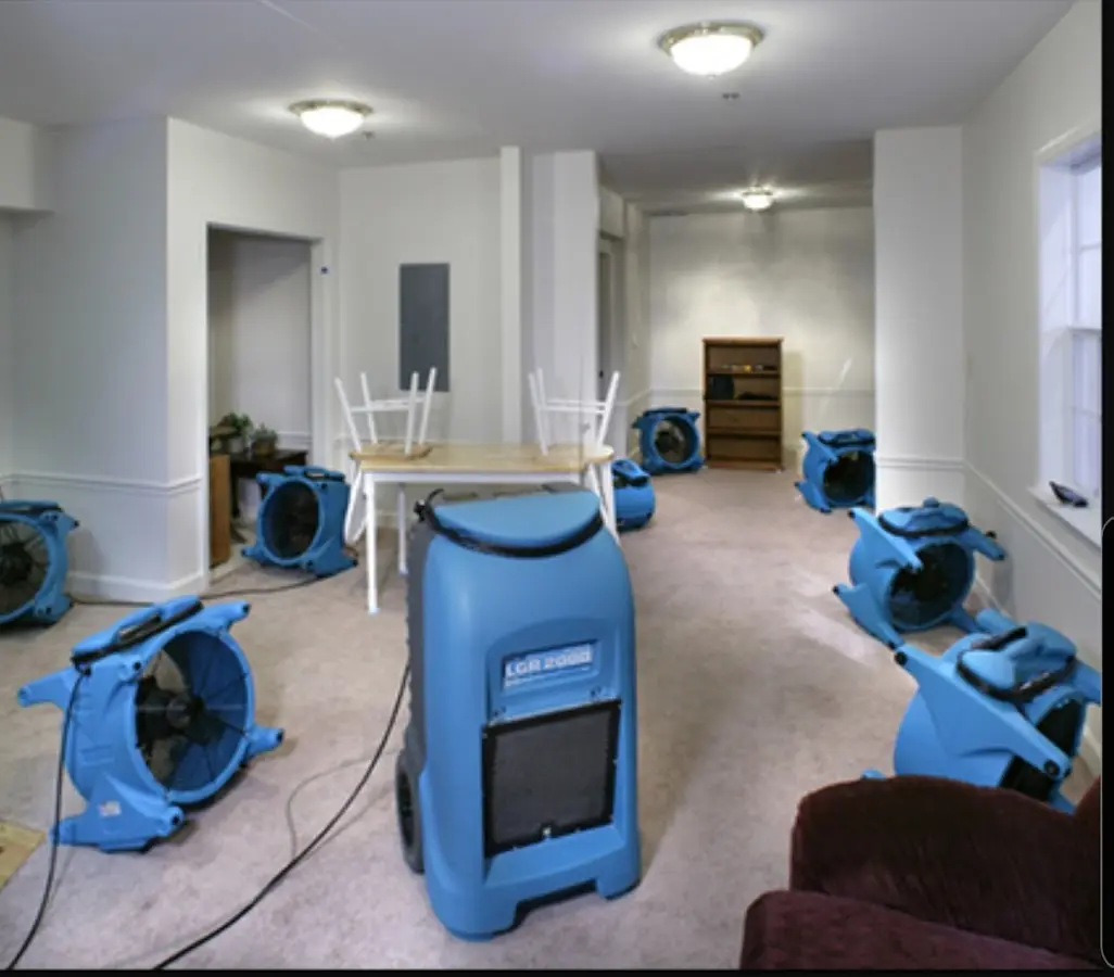 Air movers and dehumidifier setup for Water Damage Restoration in Imperial